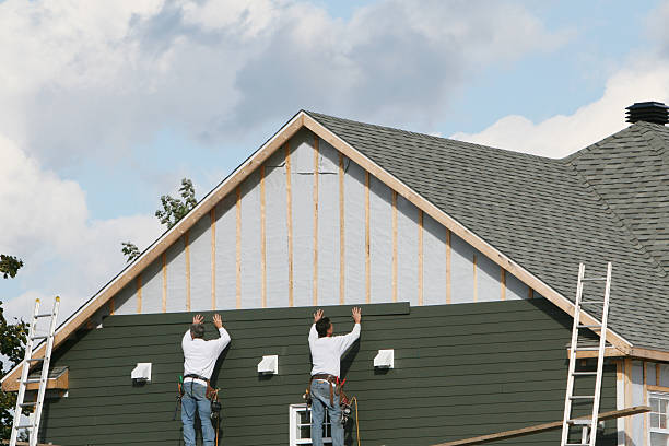 Professional Siding Installation technician working in Medford, MA